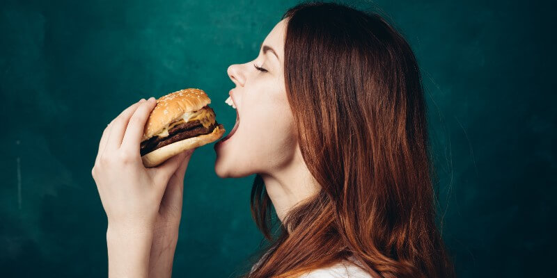 woman eating burger