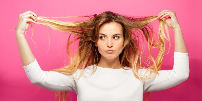 women holding out hair