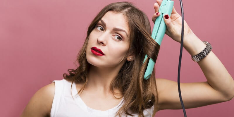 woman curling hair