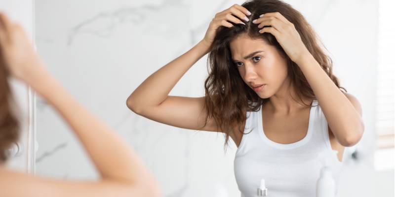 woman checking scalp